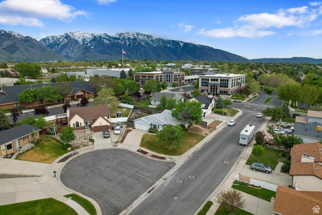 aerial view of residential area with mountains