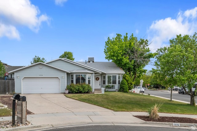 ranch-style house with a garage, a front yard, and driveway