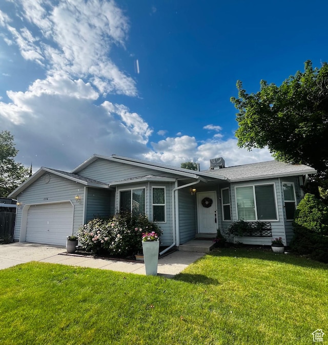 1206 E Moss Cir, Midvale, UT 84047 - ranch-style home with a garage, concrete driveway, and a front yard