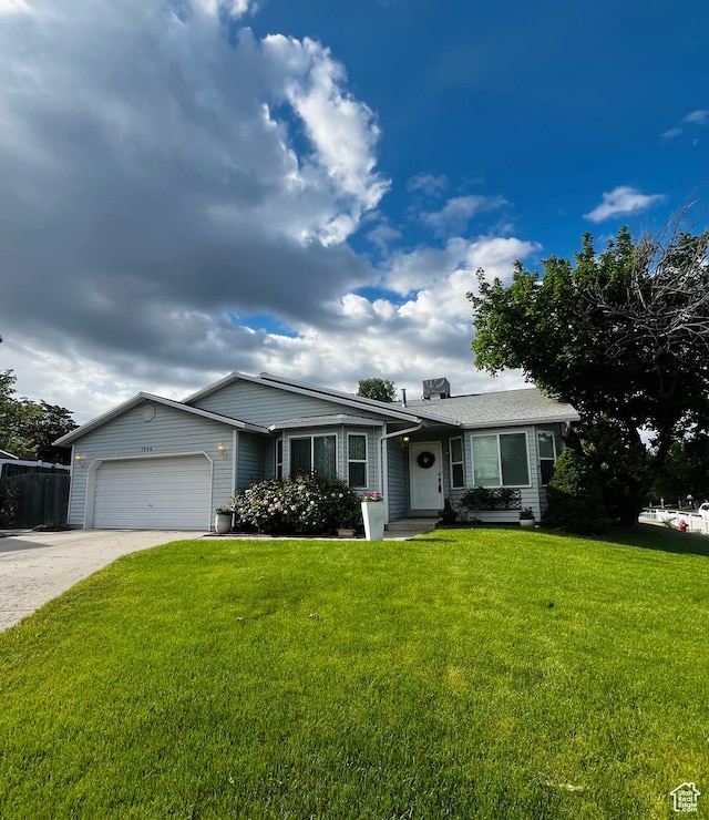 1206 E Moss Cir, Midvale, UT 84047 - single story home with an attached garage and concrete driveway