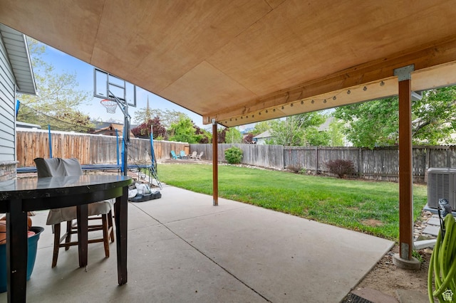 view of patio / terrace featuring central air condition unit and a trampoline