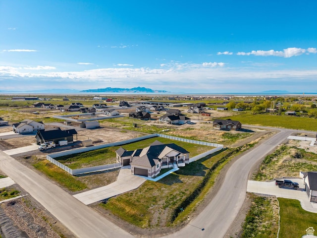 aerial view of residential area featuring a mountain backdrop