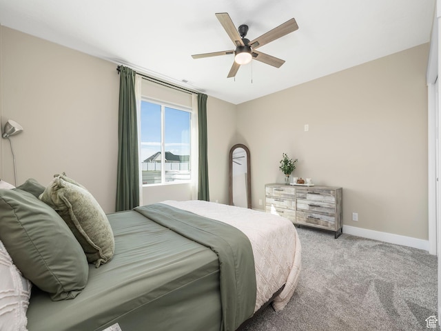bedroom with carpet, baseboards, and ceiling fan