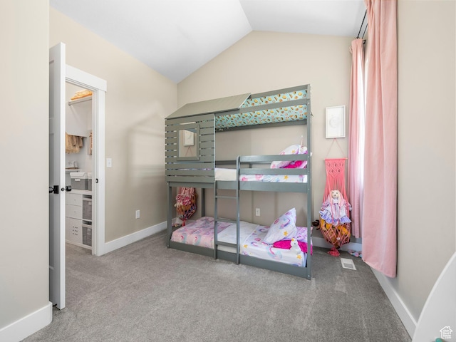 bedroom featuring carpet flooring, vaulted ceiling, and baseboards