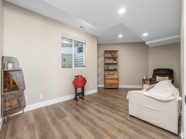 sitting room with wood finished floors, baseboards, and recessed lighting