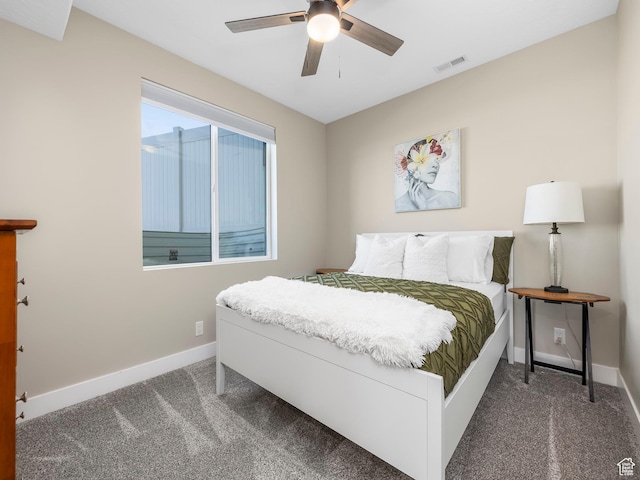 carpeted bedroom featuring baseboards and ceiling fan