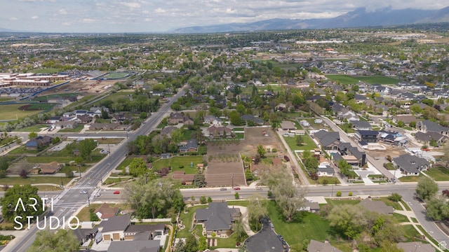 view of property location with nearby suburban area and mountains