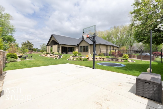 view of sport court with basketball hoop