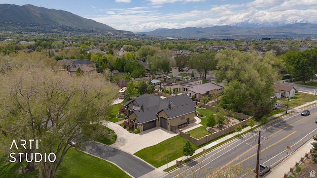 view of property location with mountains and nearby suburban area