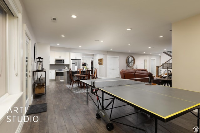 recreation room featuring recessed lighting and dark wood-style floors
