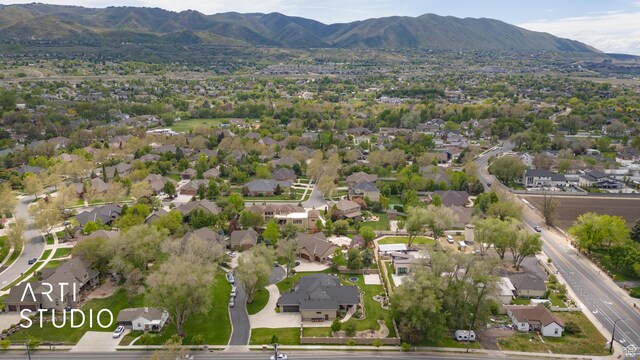aerial overview of property's location with mountains and nearby suburban area