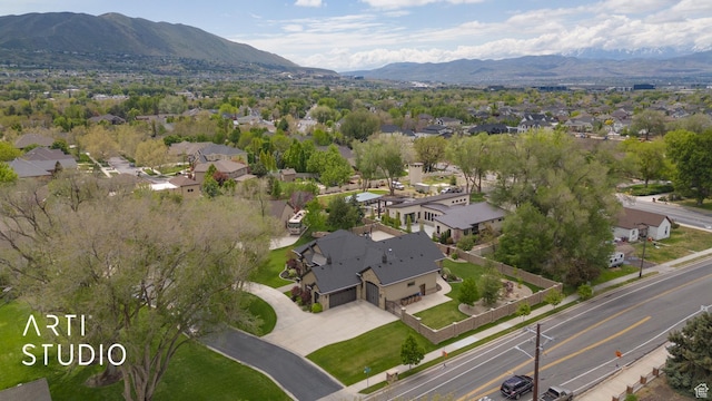 aerial overview of property's location with mountains and nearby suburban area
