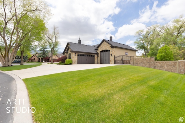 view of front facade with stone siding, a gate, concrete driveway, and a garage