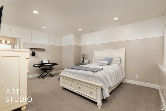 bedroom with light carpet, recessed lighting, and baseboards