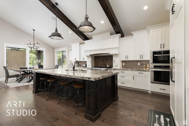 kitchen featuring decorative backsplash, a sink, white cabinets, dark wood-style floors, and recessed lighting