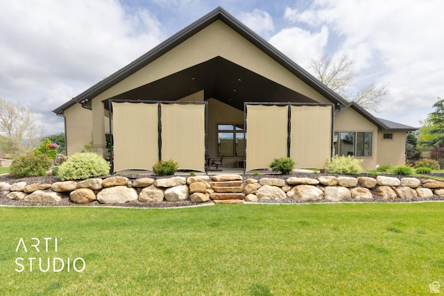 view of home's exterior featuring a yard and stucco siding