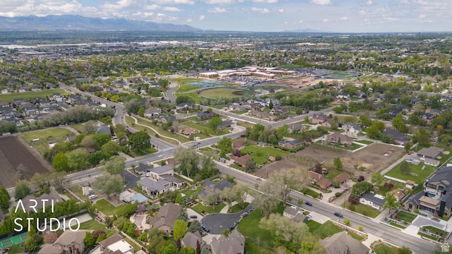 view of property location with a mountainous background and nearby suburban area