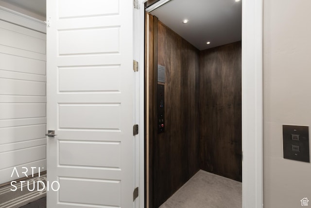 elevator featuring recessed lighting