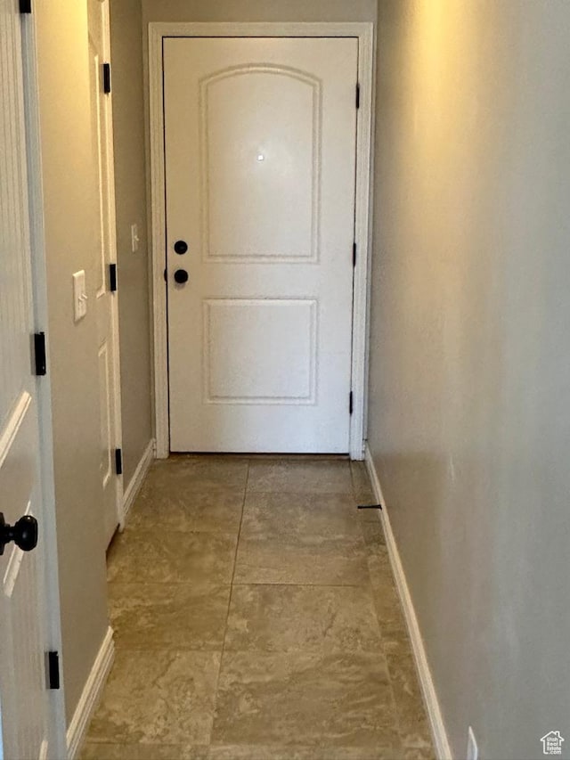 doorway with baseboards