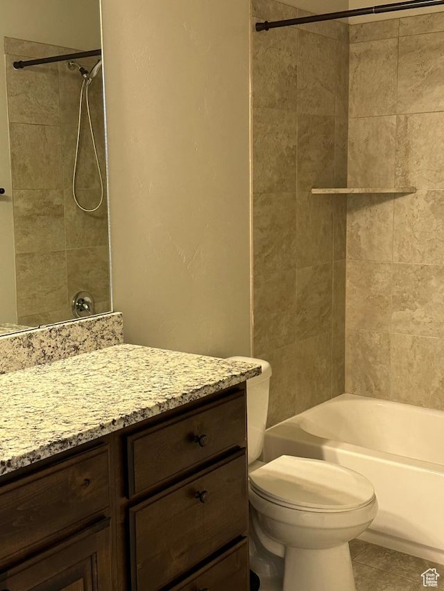bathroom featuring vanity, toilet, shower / bath combination, and tile patterned floors