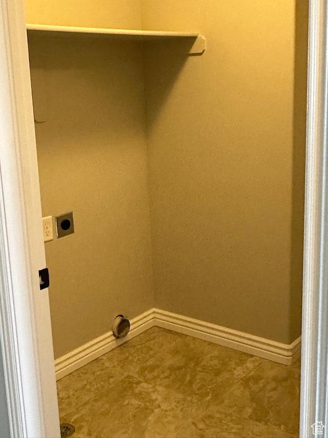 laundry room featuring hookup for an electric dryer and baseboards