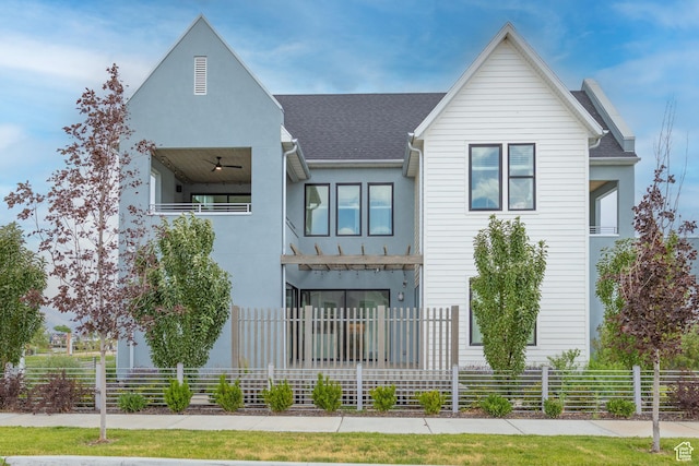 6721 W Lake Ave Unit 121, South Jordan, UT 84009 - view of front of house featuring a balcony, roof with shingles, and stucco siding