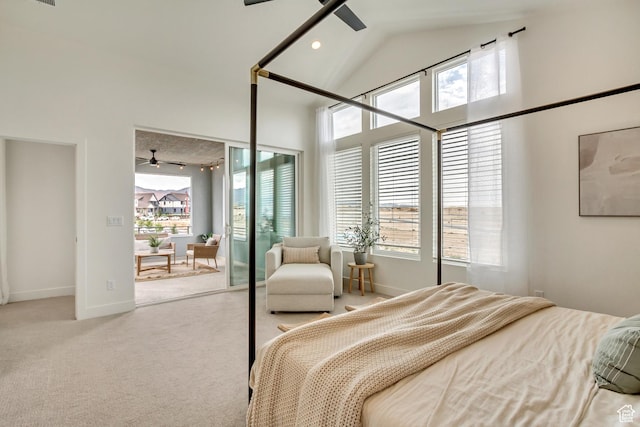 carpeted bedroom featuring multiple windows, high vaulted ceiling, baseboards, and ceiling fan