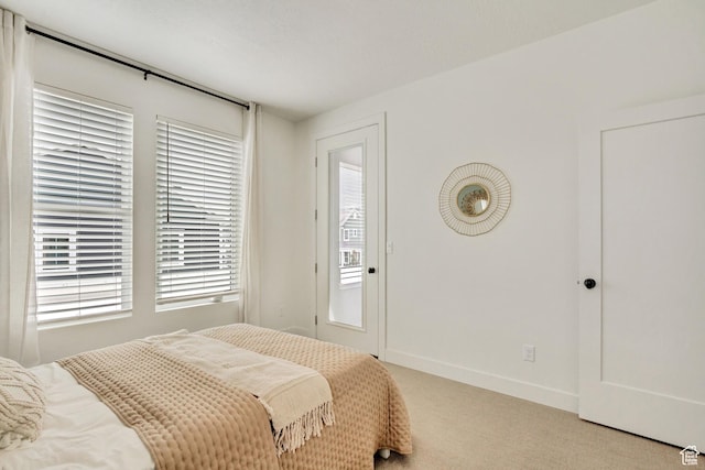 bedroom with carpet and baseboards