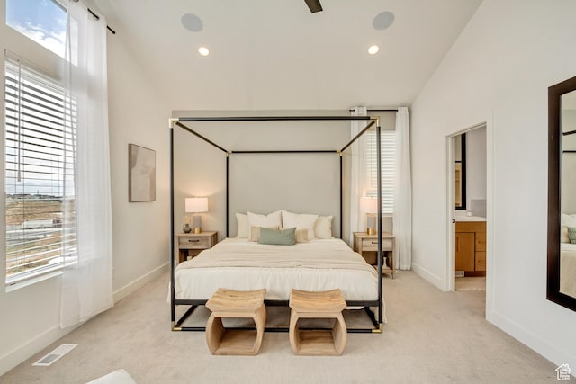 bedroom featuring light carpet, baseboards, recessed lighting, and vaulted ceiling