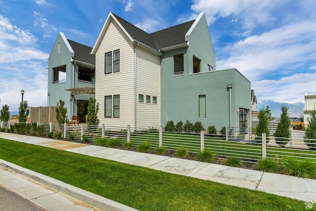 view of front of house featuring stucco siding