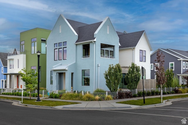 6721 W Lake Ave Unit 121, South Jordan, UT 84009 - view of front of house featuring stucco siding and roof with shingles