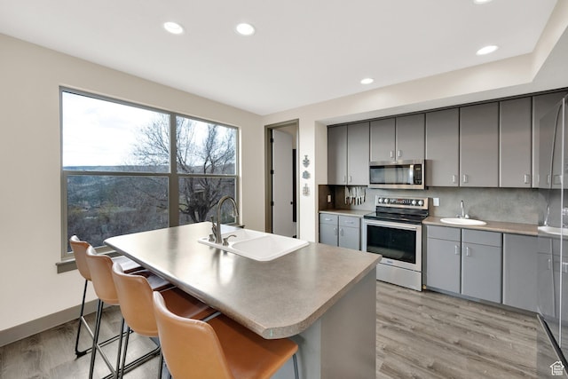 9048 E Acorn Way Unit 984, Heber City, UT 84032 - kitchen featuring stainless steel appliances, a sink, gray cabinetry, light wood-style floors, and recessed lighting