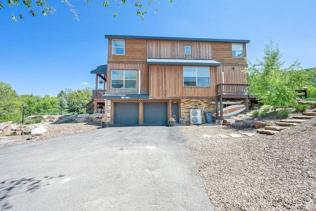 9048 E Acorn Way Unit 984, Heber City, UT 84032 - view of front of home with asphalt driveway, stone siding, and a garage