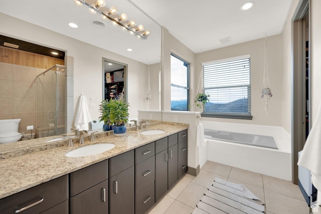 9048 E Acorn Way Unit 984, Heber City, UT 84032 - full bathroom featuring double vanity, a stall shower, tile patterned flooring, a garden tub, and toilet