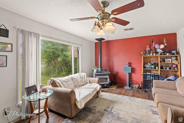 382 W 200 N, St George, UT 84770 - living area with wood finished floors, a wood stove, and a ceiling fan