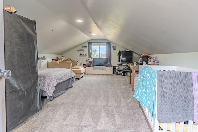 carpeted bedroom with vaulted ceiling