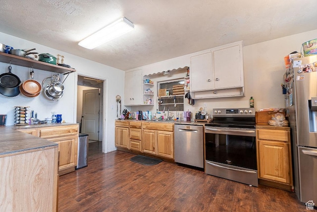 kitchen with appliances with stainless steel finishes, open shelves, a sink, dark wood-style flooring, and a textured ceiling