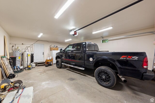 382 W 200 N, St George, UT 84770 - garage with electric water heater, a garage door opener, and washer and dryer