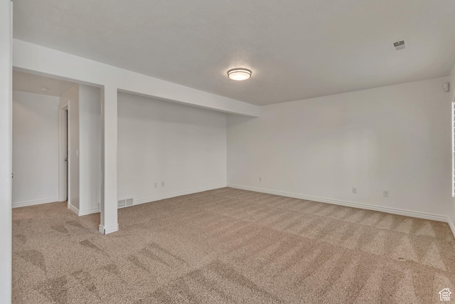 basement with carpet flooring and baseboards