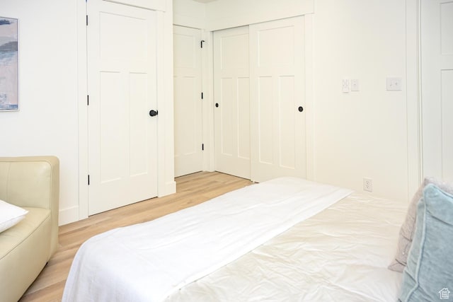 bedroom with light wood-style floors