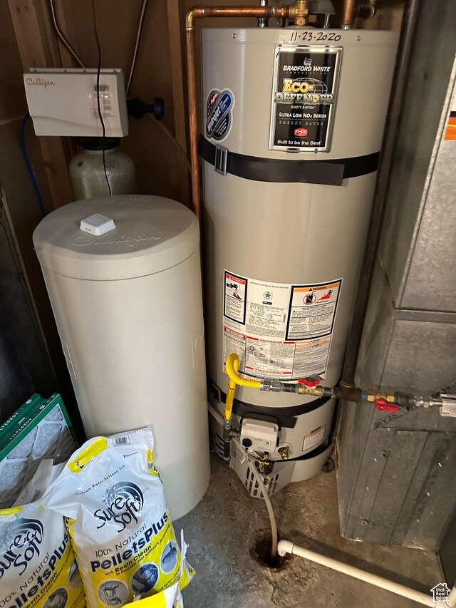 utility room with strapped water heater