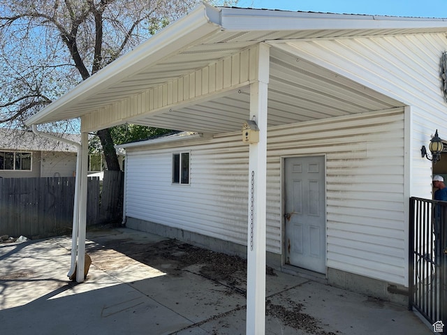 view of home's exterior with fence and a patio area