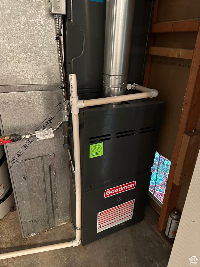 utility room with heating unit