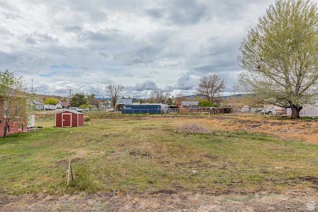 98 S Center St, Redmond, UT 84652 - view of yard featuring a storage unit, an outdoor structure, and a residential view