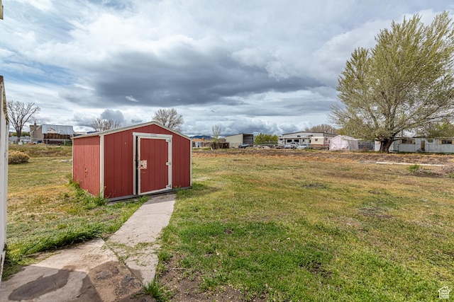 98 S Center St, Redmond, UT 84652 - view of grassy yard with a storage shed and an outdoor structure
