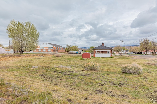 98 S Center St, Redmond, UT 84652 - view of green lawn with a storage unit and an outbuilding