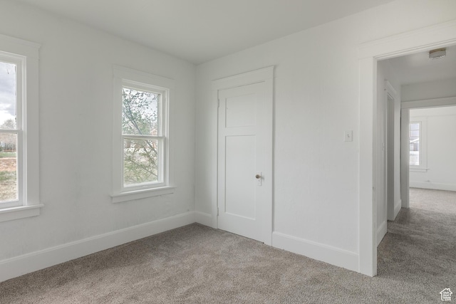 98 S Center St, Redmond, UT 84652 - unfurnished bedroom featuring carpet flooring, multiple windows, and baseboards