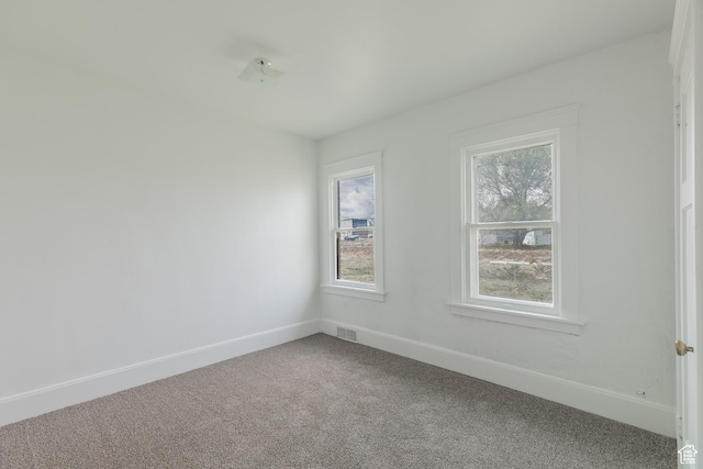 98 S Center St, Redmond, UT 84652 - carpeted empty room featuring plenty of natural light and baseboards