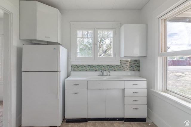 98 S Center St, Redmond, UT 84652 - kitchen with freestanding refrigerator, plenty of natural light, and light countertops