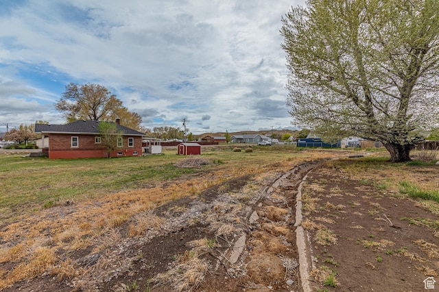 98 S Center St, Redmond, UT 84652 - view of yard with a storage unit and an outbuilding